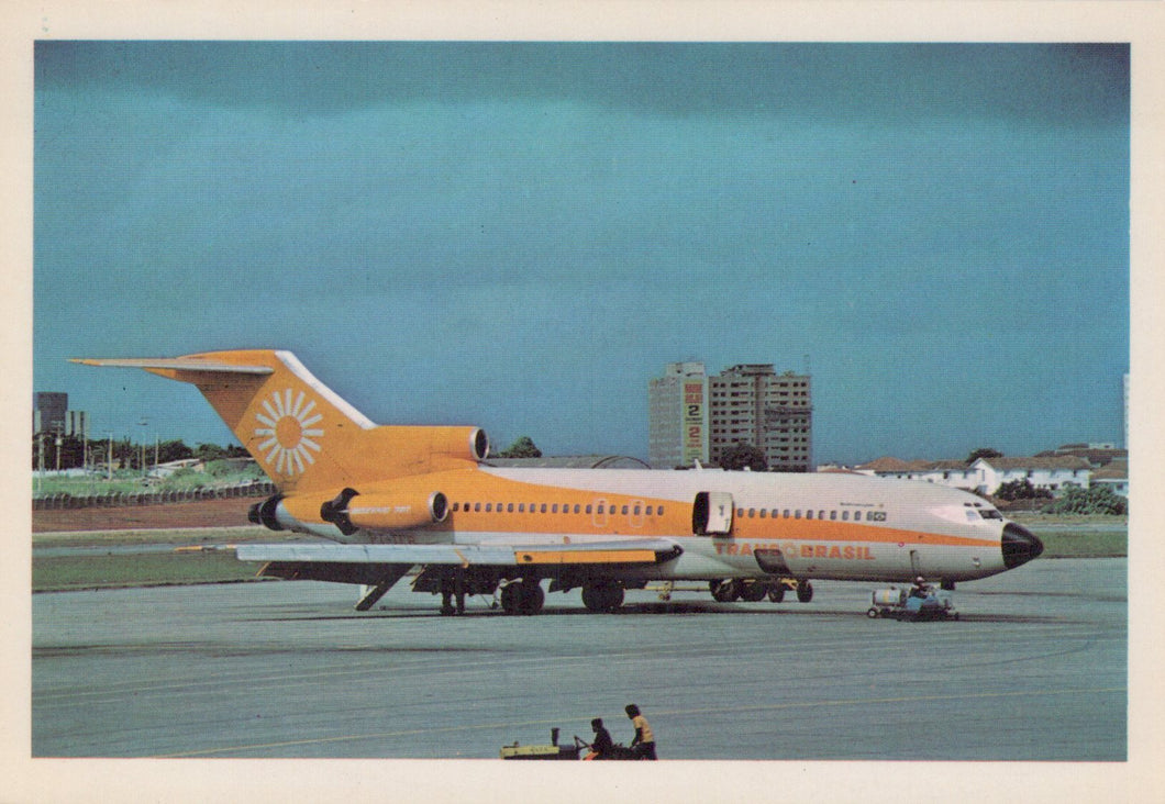 Vintage airplane on a runway with a clear sky background