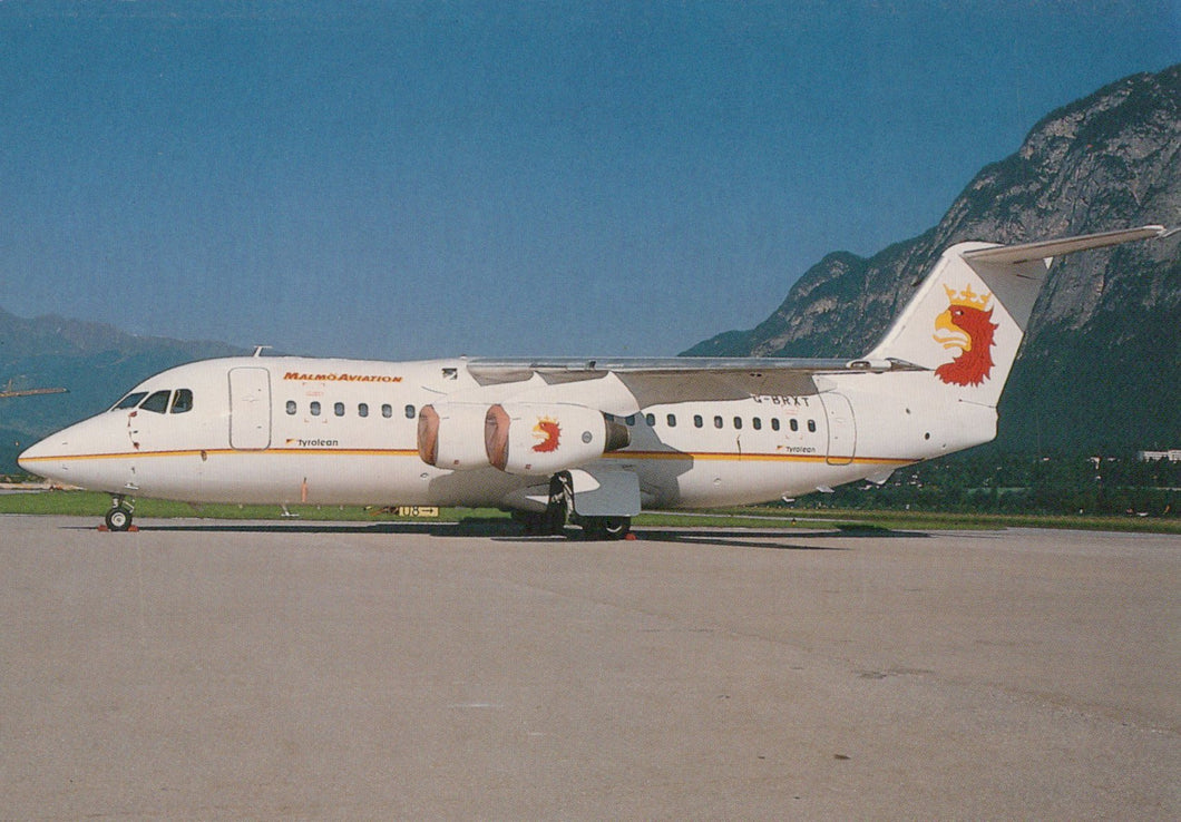 Airbus A320-214 on a runway with mountains in the background