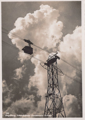 Cable car system with tower against a cloudy sky