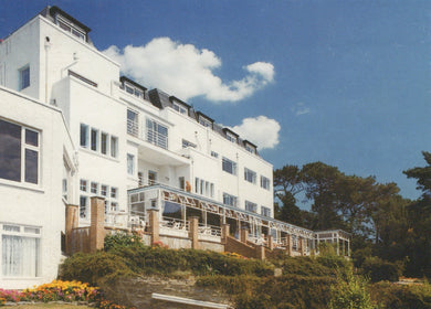 White building with balconies on a clear day
