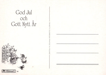 Greeting card with two cartoon characters and text 'God Jul och Gott Nytt Ar' on a white background.