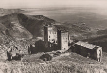 Load image into Gallery viewer, Vintage black and white photograph of a castle on a hill with a vast landscape in the background.
