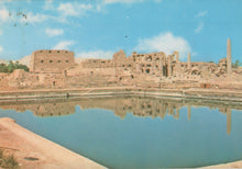 Load image into Gallery viewer, Ruins of an ancient city with a large pool in the foreground
