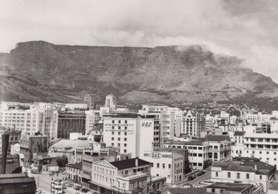 Vintage black and white photo of a cityscape with Table Mountain in the background