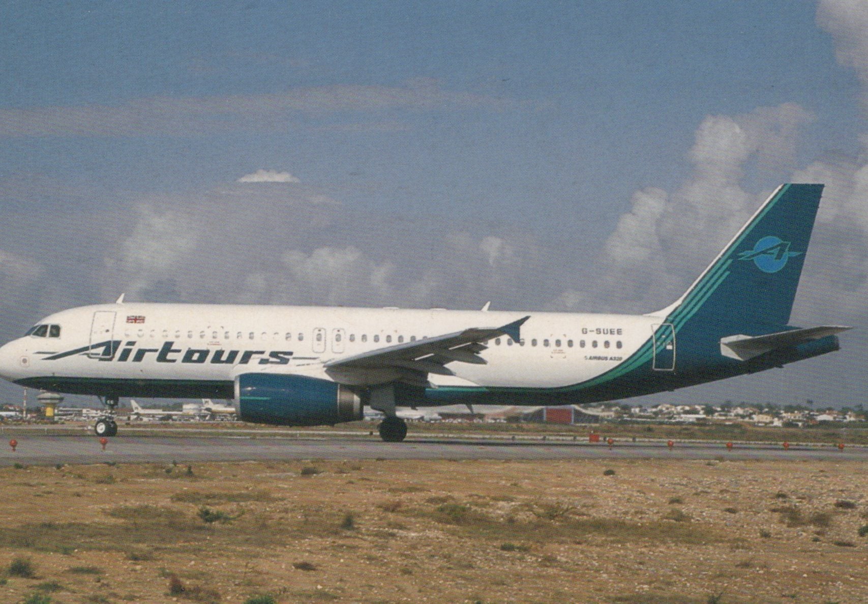 Airtours airplane on a runway with a cloudy sky background