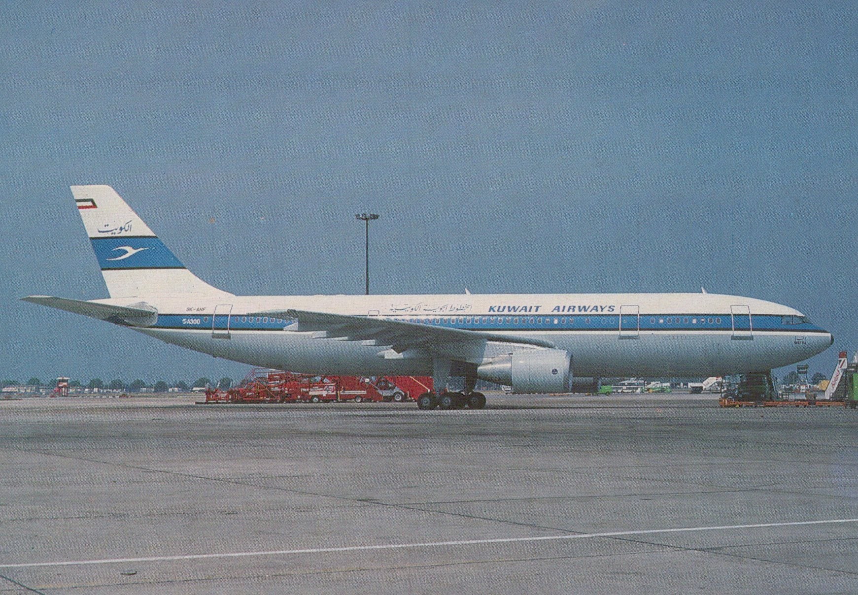 Kuwait Airways airplane on a runway with clear sky