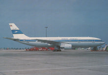 Load image into Gallery viewer, Kuwait Airways airplane on a runway with clear sky
