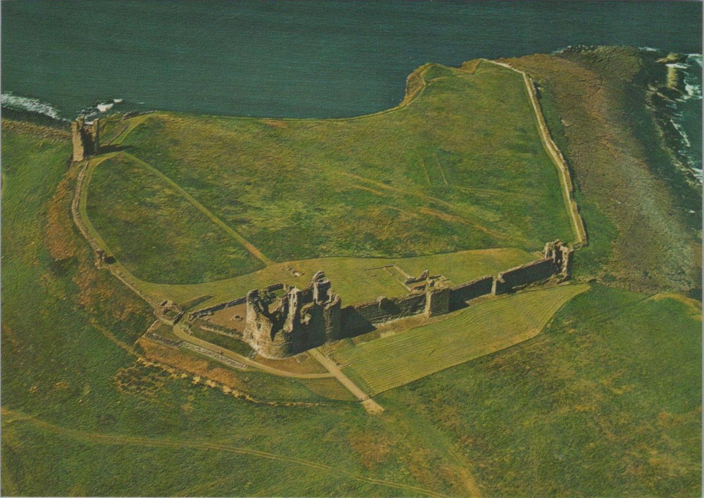 Northumberland Postcard - Aerial View of Dunstanburgh Castle   RR23566
