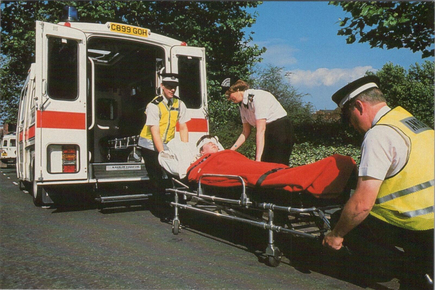 Medical Postcard: St John Ambulance Crew with Patient and Ambulance  XT2216