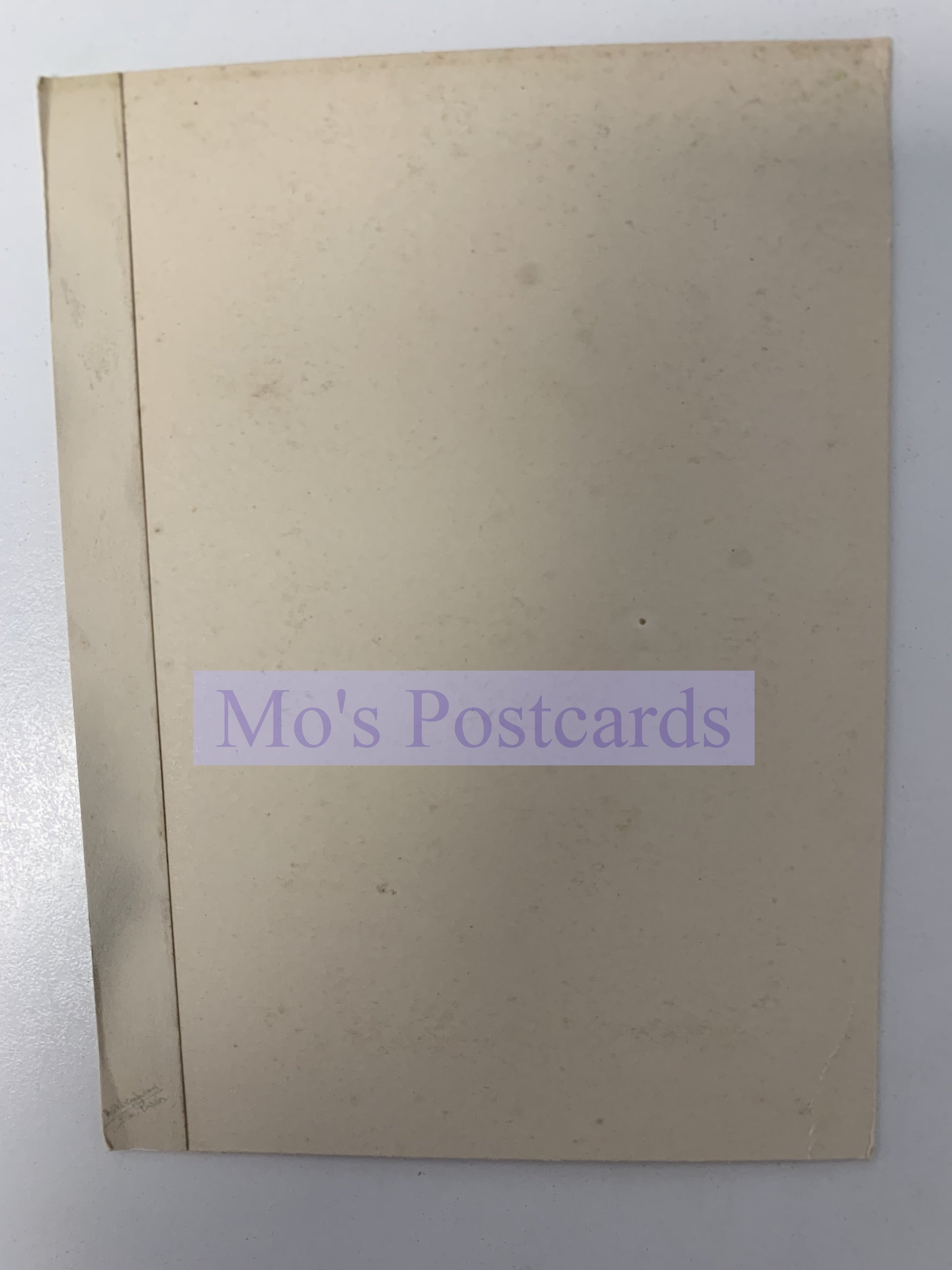 Beige postcard book with 'Mo's Postcards' label on a white background