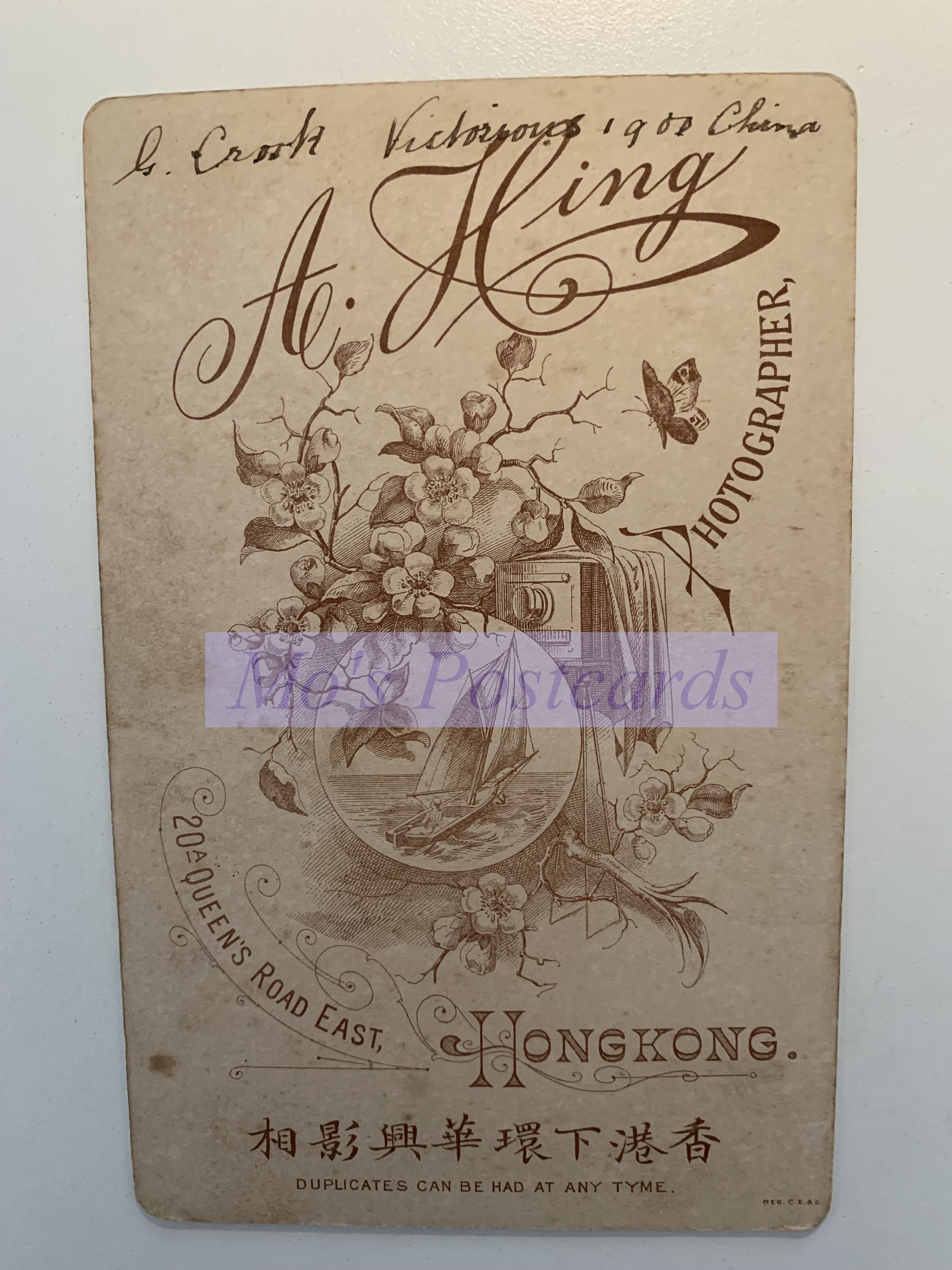 Vintage-style photo card with decorative elements and text on a white background