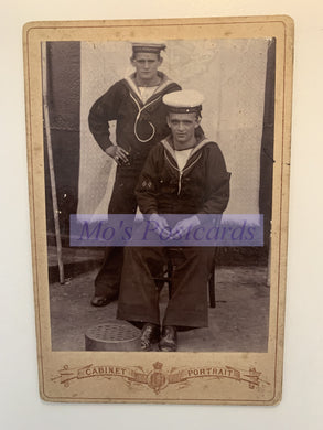 Vintage photo of two men in sailor outfits with a 'Cabinet Portrait' label.