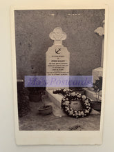 Load image into Gallery viewer, Grave with headstone and wreath in a cemetery, featuring &#39;Mo&#39;s Postcards&#39; watermark.
