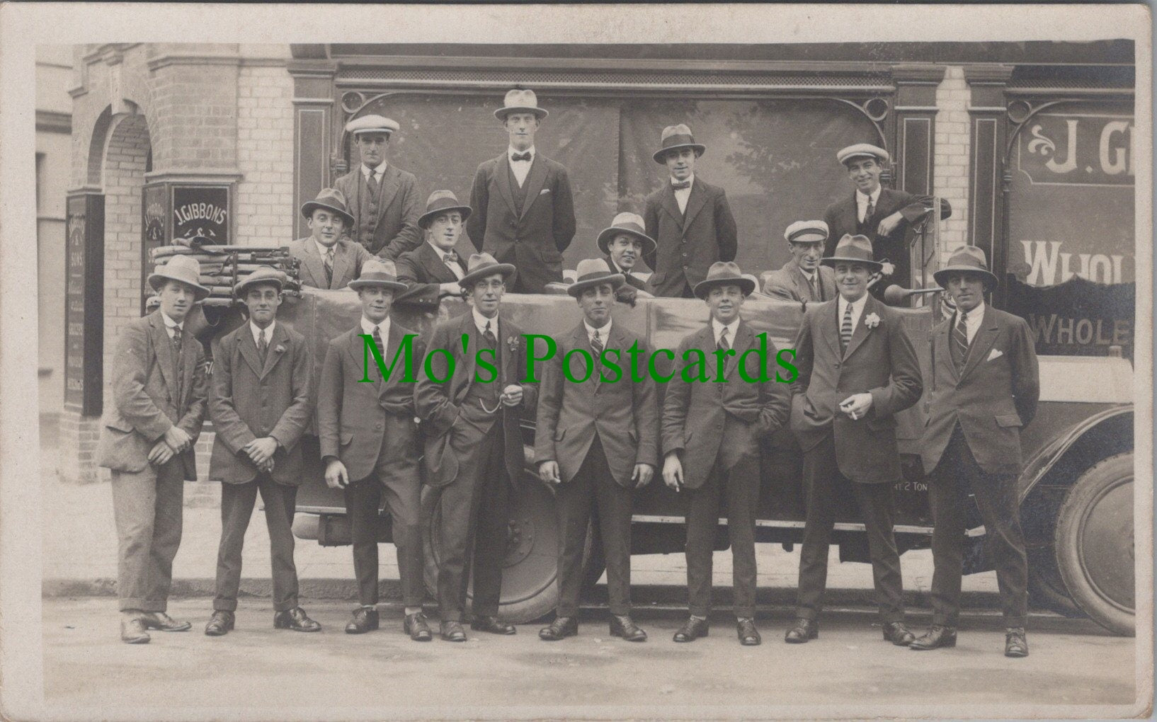 Unknown Location Postcard - Group of Men Outside J.Gibbons & Sons Premises Ref.SW9900