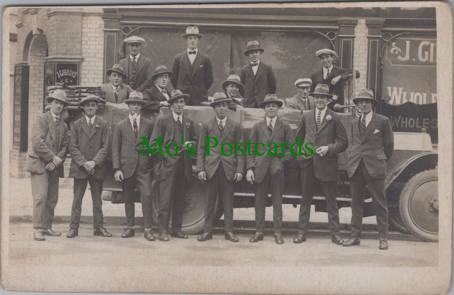 Unknown Location Postcard - Group of Men Outside J.Gibbons & Sons Premises Ref.SW9902