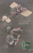 Load image into Gallery viewer, Greetings Postcard - Lady, Flowers and an Aeroplane - Mo’s Postcards 

