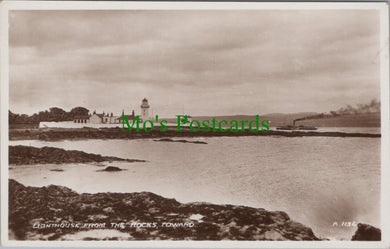 Lighthouse From The Rocks, Toward