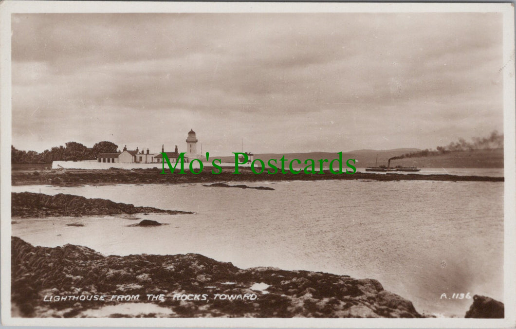 Lighthouse From The Rocks, Toward